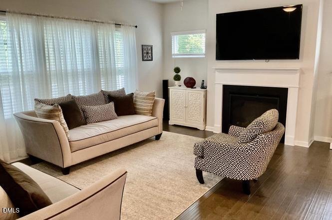 1807 Wrenn Road Durham, NC 27703 - Photo 5 of 43 a living room with furniture and a flat screen tv
