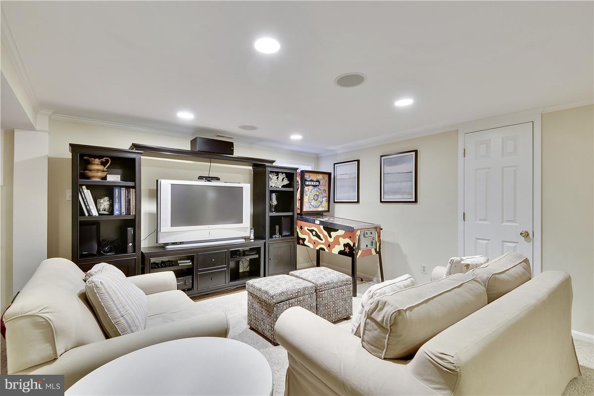 5 Cold Spring Court Potomac, MD 20854 - Photo 19 of 30 a living room with furniture and a flat screen tv
