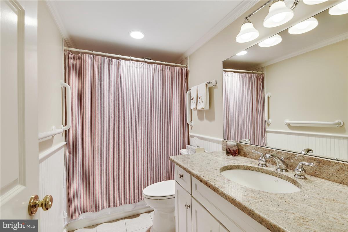 5 Cold Spring Court Potomac, MD 20854 - Photo 21 of 30 a bathroom with a granite countertop sink and a mirror