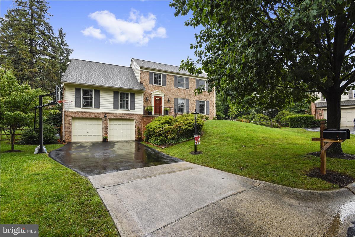 5 Cold Spring Court Potomac, MD 20854 - Photo 23 of 30 a front view of a house with garden