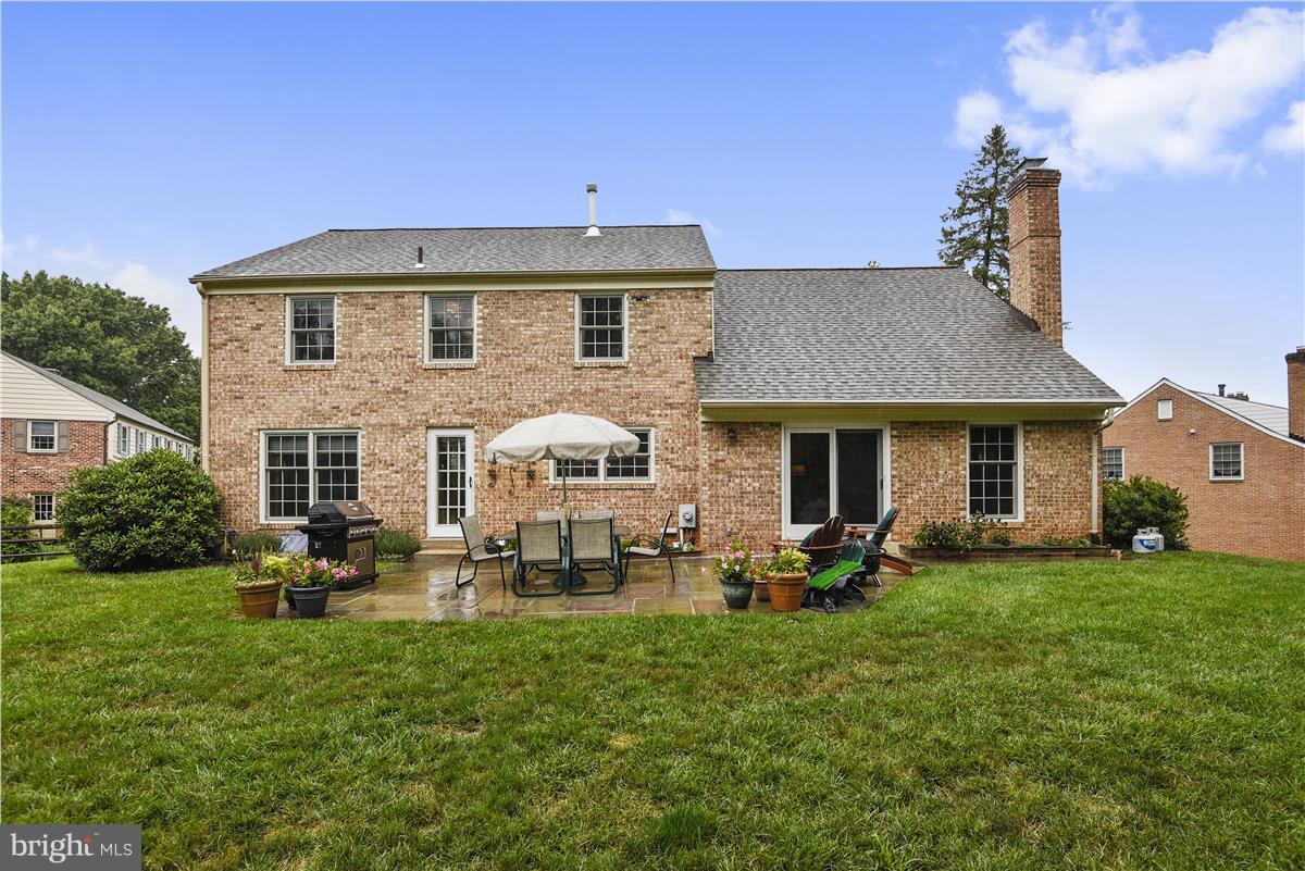 5 Cold Spring Court Potomac, MD 20854 - Photo 24 of 30 a front view of a house with a garden and yard