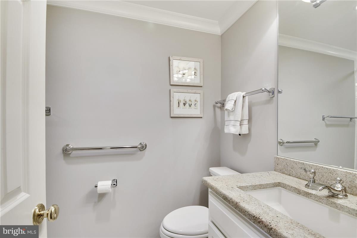 5 Cold Spring Court Potomac, MD 20854 - Photo 10 of 30 a bathroom with a granite countertop toilet and a sink