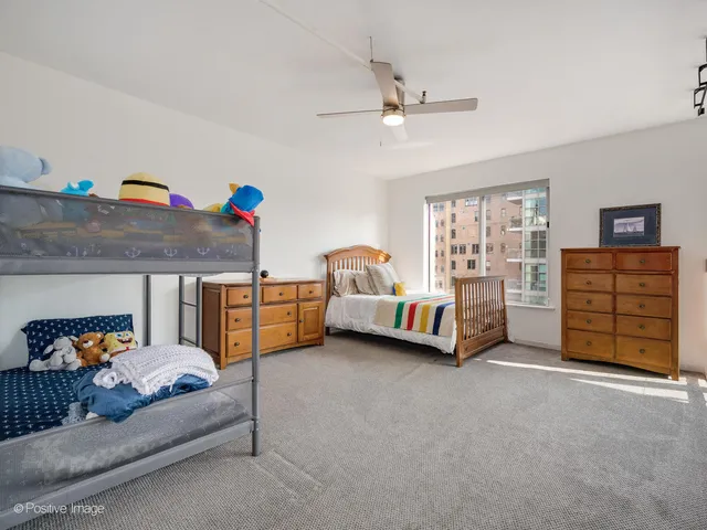 a bedroom with bed and window