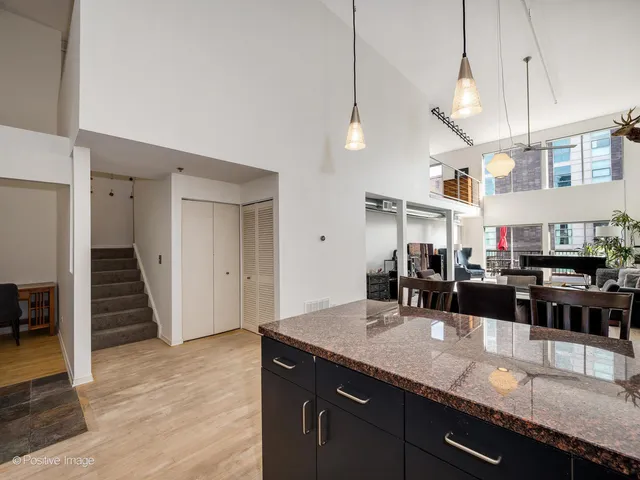 a kitchen with lots of counter space and wooden floor