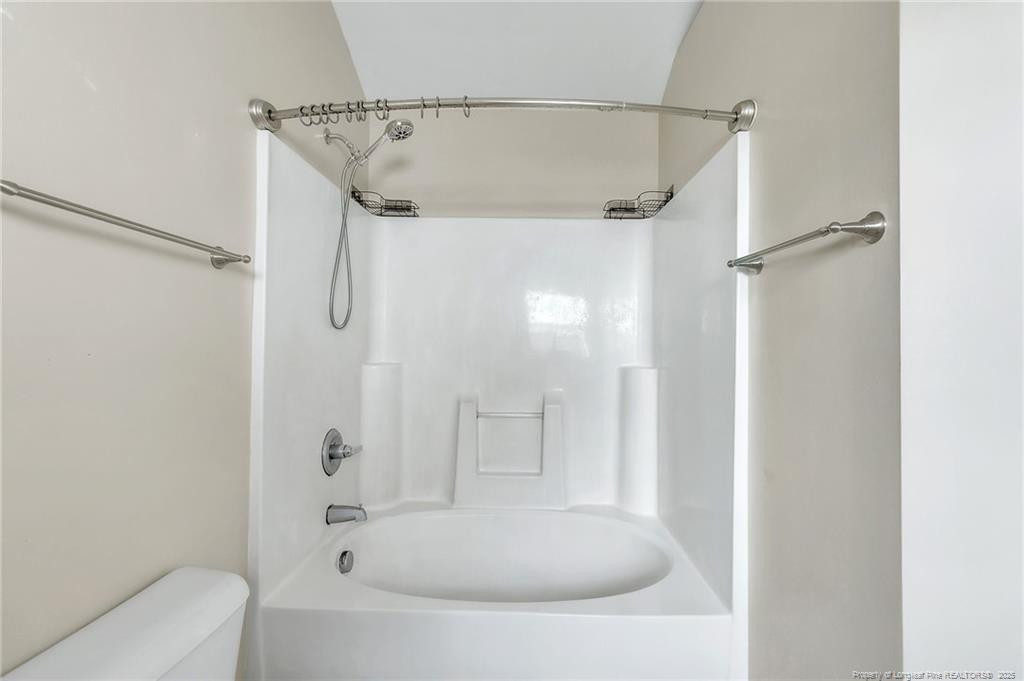 1948 Yellowbrick Road Fayetteville, NC 28314 - Photo 11 of 22 a bathroom with a tub shower vanity and a sink