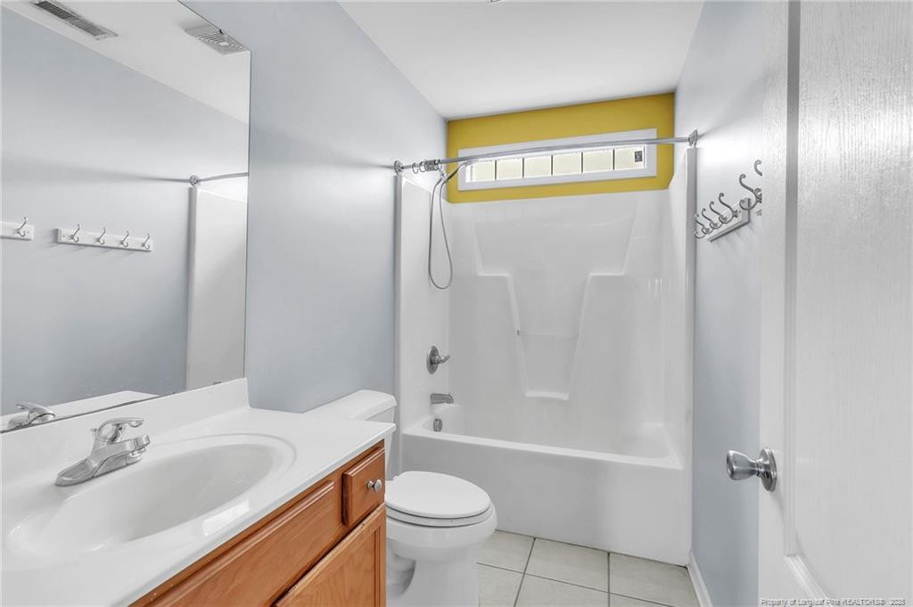 1948 Yellowbrick Road Fayetteville, NC 28314 - Photo 15 of 22 a bathroom with a sink a toilet and shower