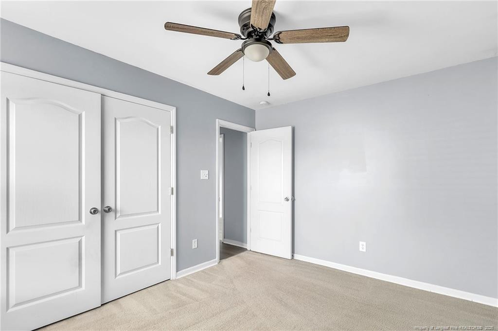 1948 Yellowbrick Road Fayetteville, NC 28314 - Photo 17 of 22 a view of a livingroom with a ceiling fan & dryer