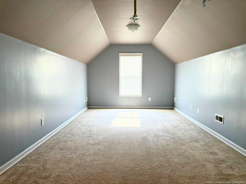 1948 Yellowbrick Road Fayetteville, NC 28314 - Photo 18 of 22 an empty room with windows and cabinet