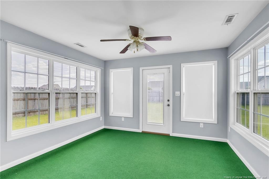 1948 Yellowbrick Road Fayetteville, NC 28314 - Photo 20 of 22 a view of an empty room with a window and a kitchen