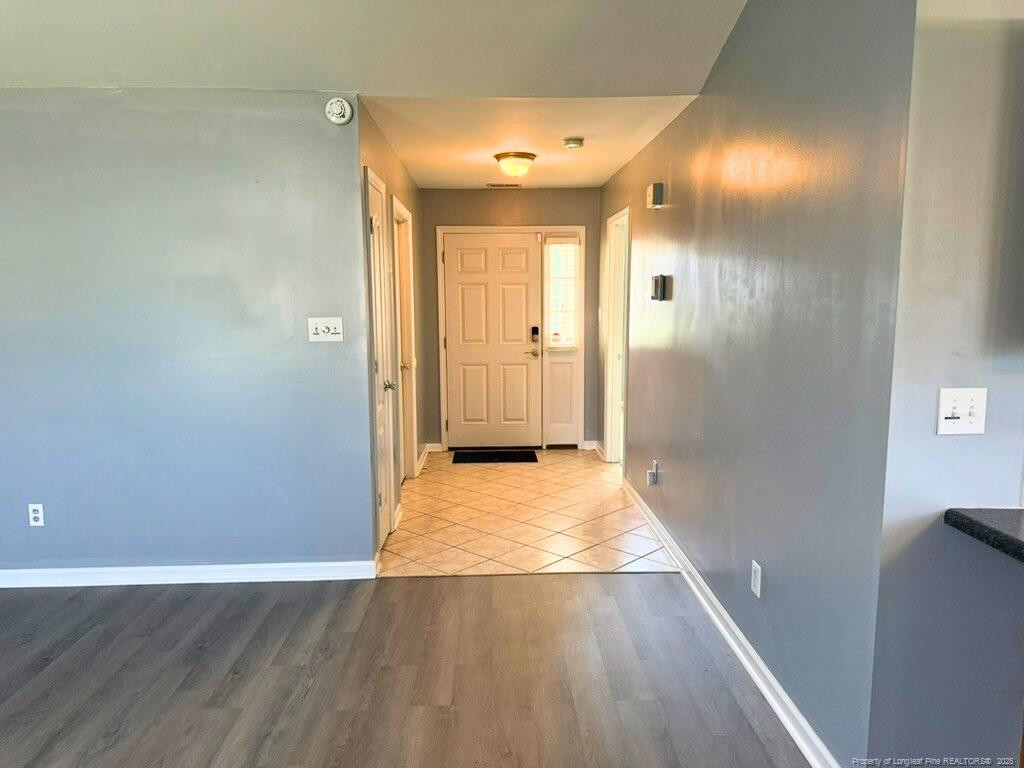 1948 Yellowbrick Road Fayetteville, NC 28314 - Photo 2 of 22 a view of a hallway with wooden floor