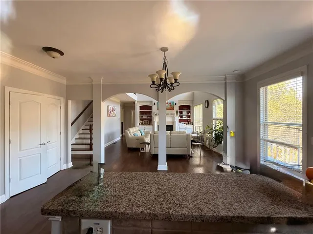 a spacious bathroom with a tub sink and mirror