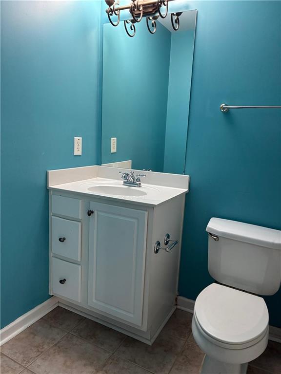 1880 Manor View Cumming, GA 30041 - Photo 32 of 63 a bathroom with a toilet sink and mirror