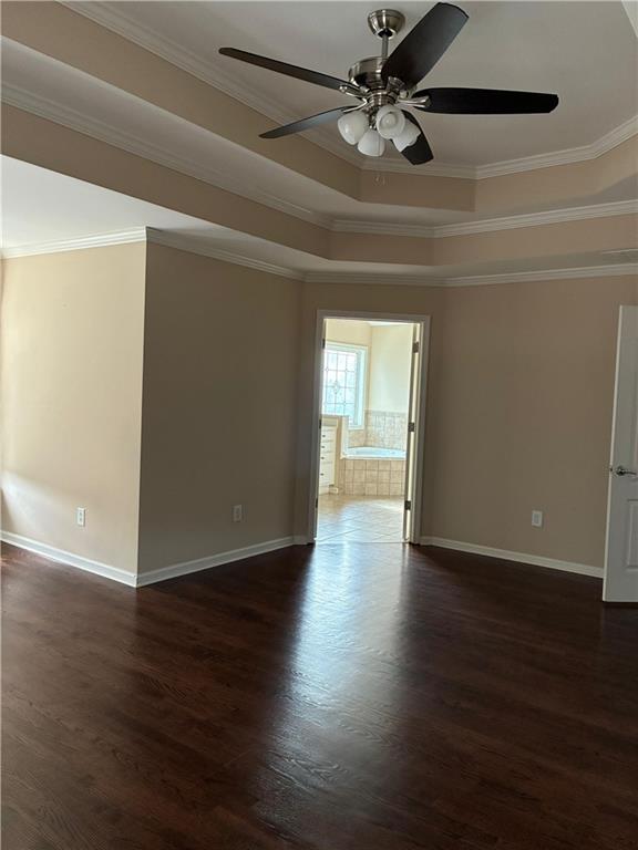1880 Manor View Cumming, GA 30041 - Photo 39 of 63 a view of an empty room with wooden floor and a ceiling fan