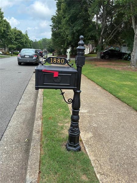 1880 Manor View Cumming, GA 30041 - Photo 4 of 63 a house view with a garden space
