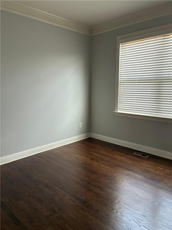1880 Manor View Cumming, GA 30041 - Photo 44 of 63 a view of an empty room with wooden floor and a window