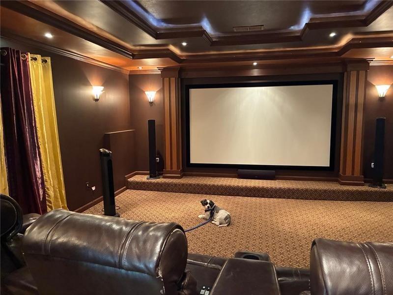 1880 Manor View Cumming, GA 30041 - Photo 48 of 63 a living room with a couch and a flat screen tv