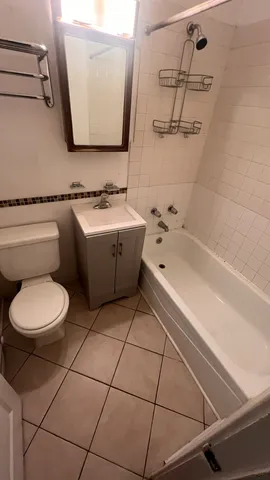 a bathroom with a sink a toilet and bathtub