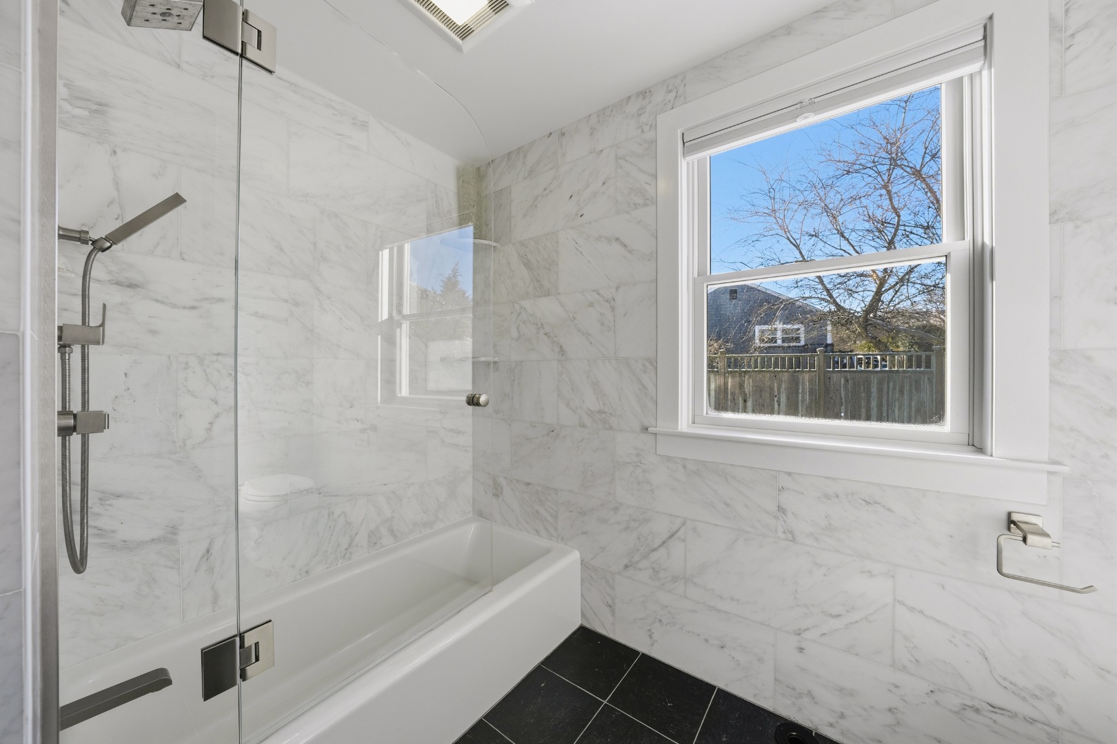 10 Pilgrim Road Nantucket, MA 02554 - Photo 25 of 65 a bathroom with a bathtub and a shower