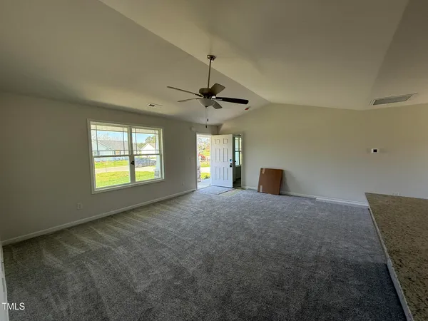 a furnished livingroom with a window