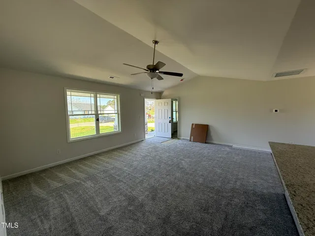 a furnished livingroom with a window