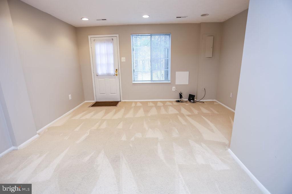 1646 Harvest Green Court Reston, VA 20194 - Photo 29 of 37 Lower Level with window and door to private back