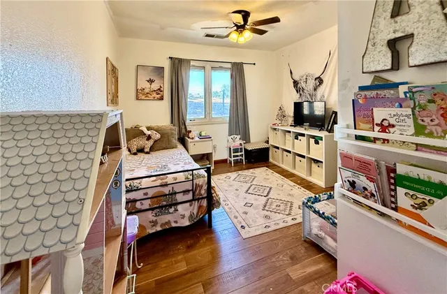 a bedroom with furniture and a chandelier