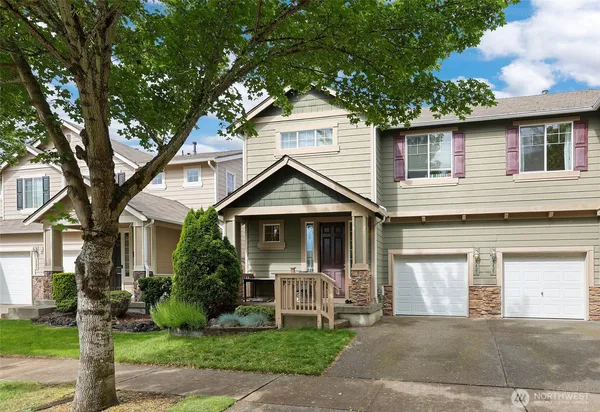 a front view of a house with garden