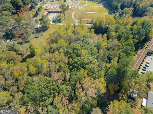 a aerial view of residential houses with yard