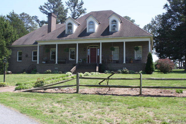 2989 The Falls Road Crewe, VA 23930 - Photo 2 of 17 a view of a house with a yard and a large tree