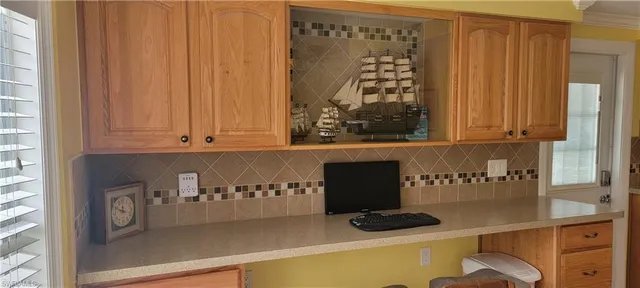 a kitchen with a sink and cabinets