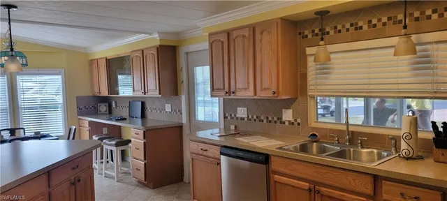 a kitchen with a sink and cabinets
