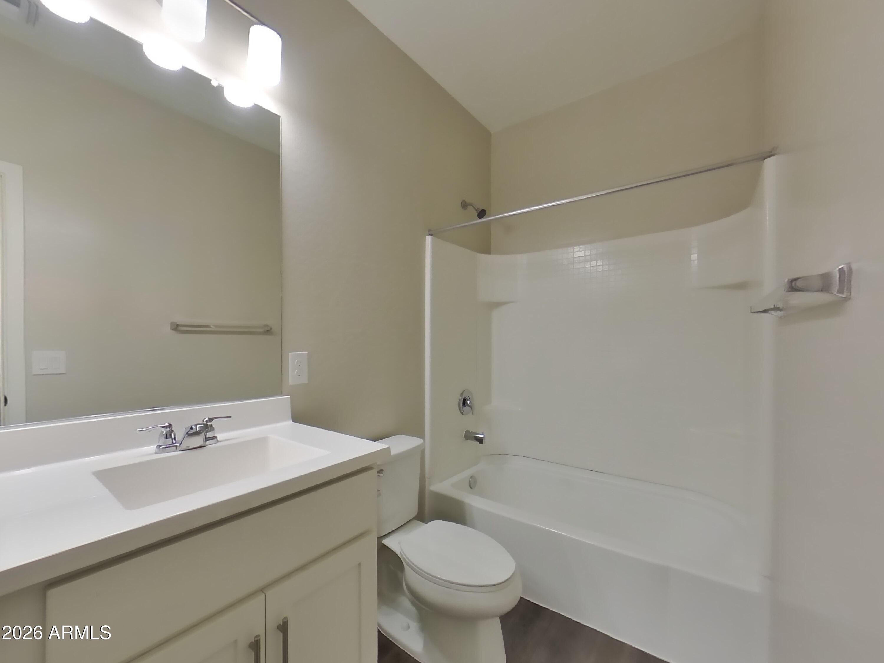 2929 North 28th Street, Unit 9 Phoenix, AZ 85016 - Photo 13 of 16 a bathroom with a sink toilet and shower