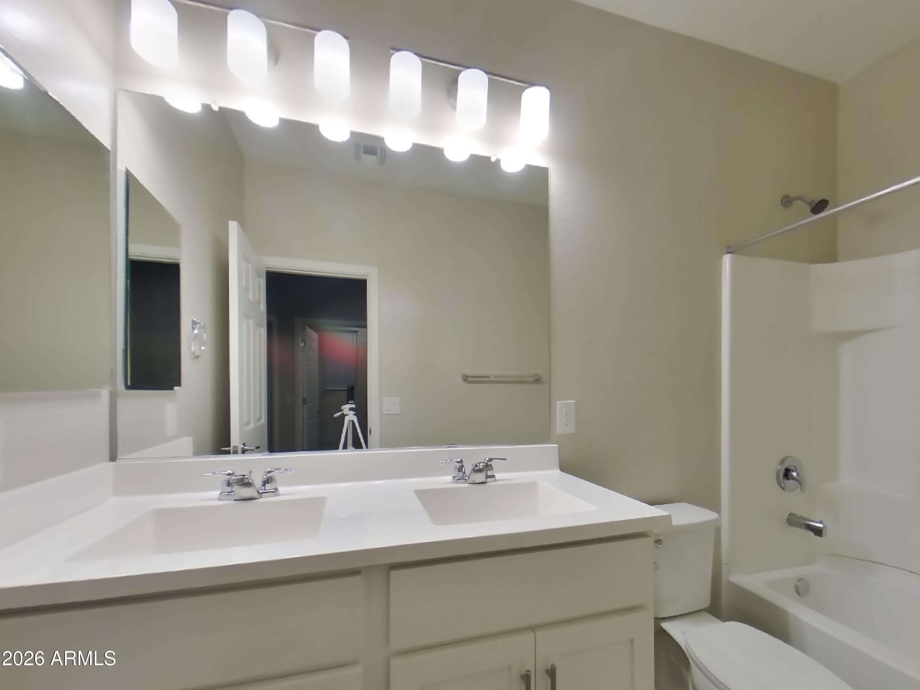 2929 North 28th Street, Unit 9 Phoenix, AZ 85016 - Photo 14 of 16 a bathroom with a sink a toilet and shower
