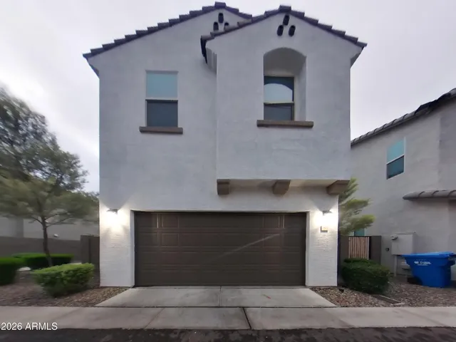 a front view of a house with garage