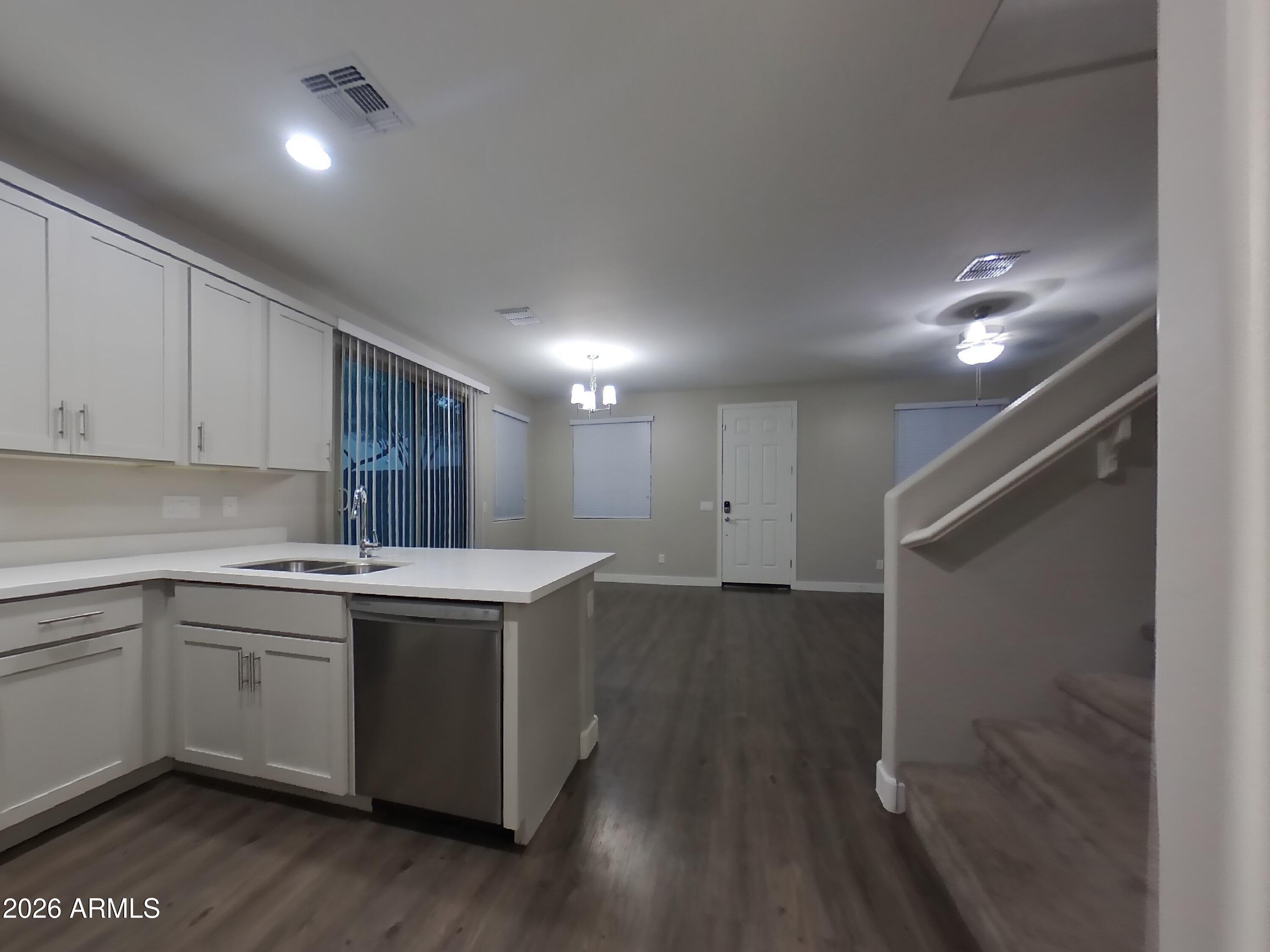 2929 North 28th Street, Unit 9 Phoenix, AZ 85016 - Photo 4 of 16 a kitchen with a sink cabinets stainless steel appliances and a window