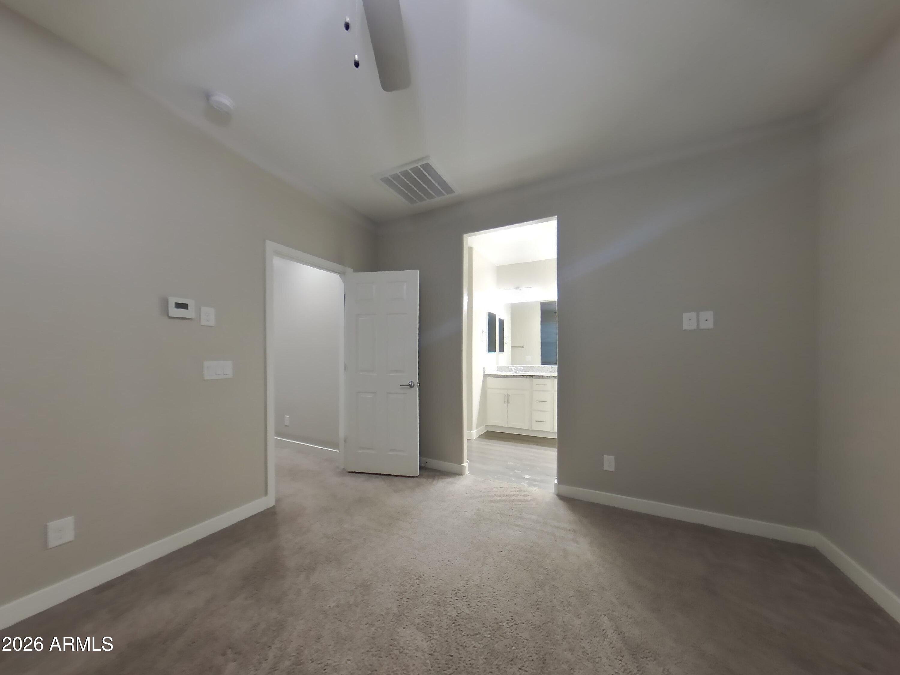 2929 North 28th Street, Unit 9 Phoenix, AZ 85016 - Photo 6 of 16 an empty room with windows