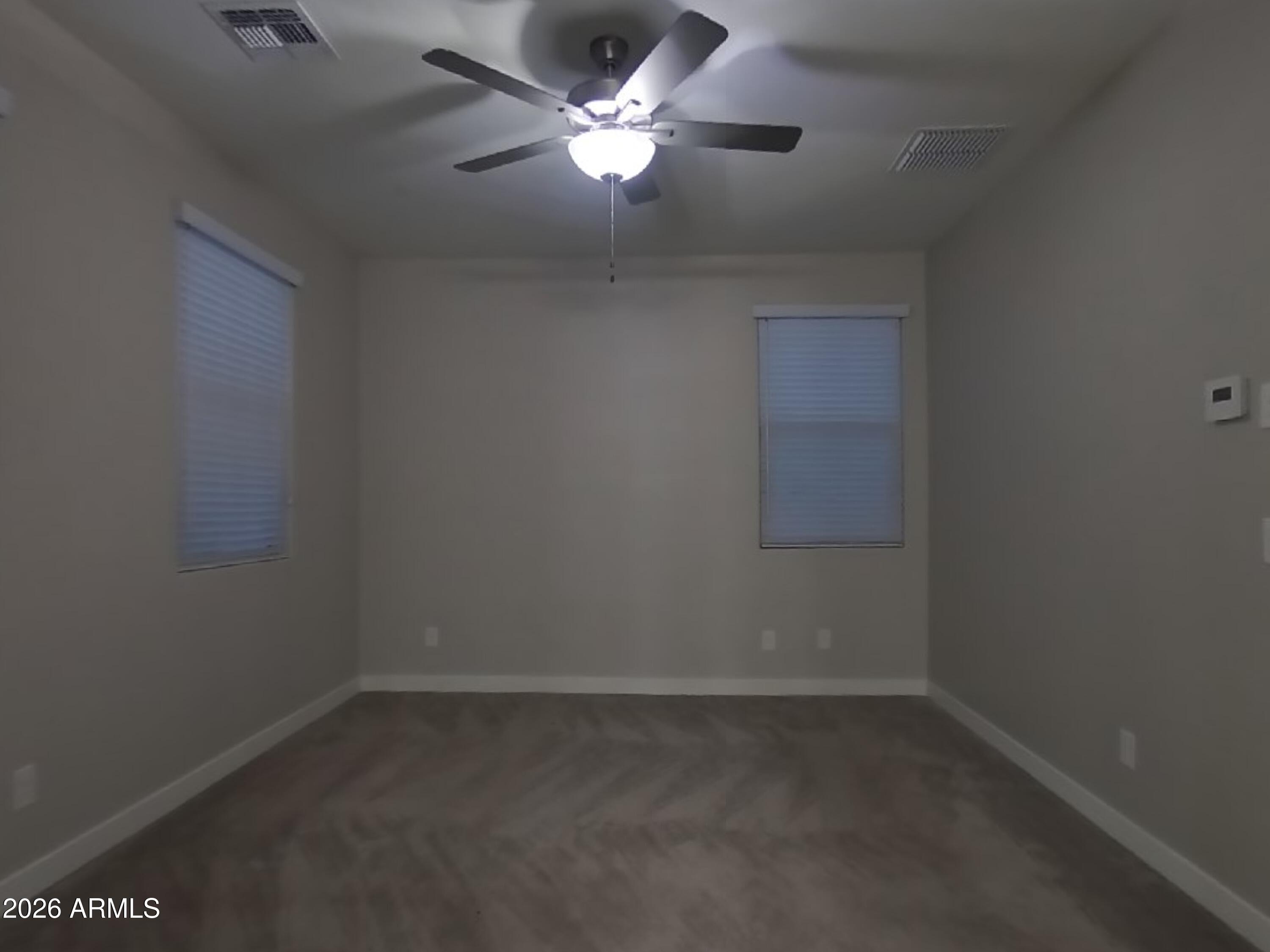 2929 North 28th Street, Unit 9 Phoenix, AZ 85016 - Photo 7 of 16 an empty room with a fan & a window