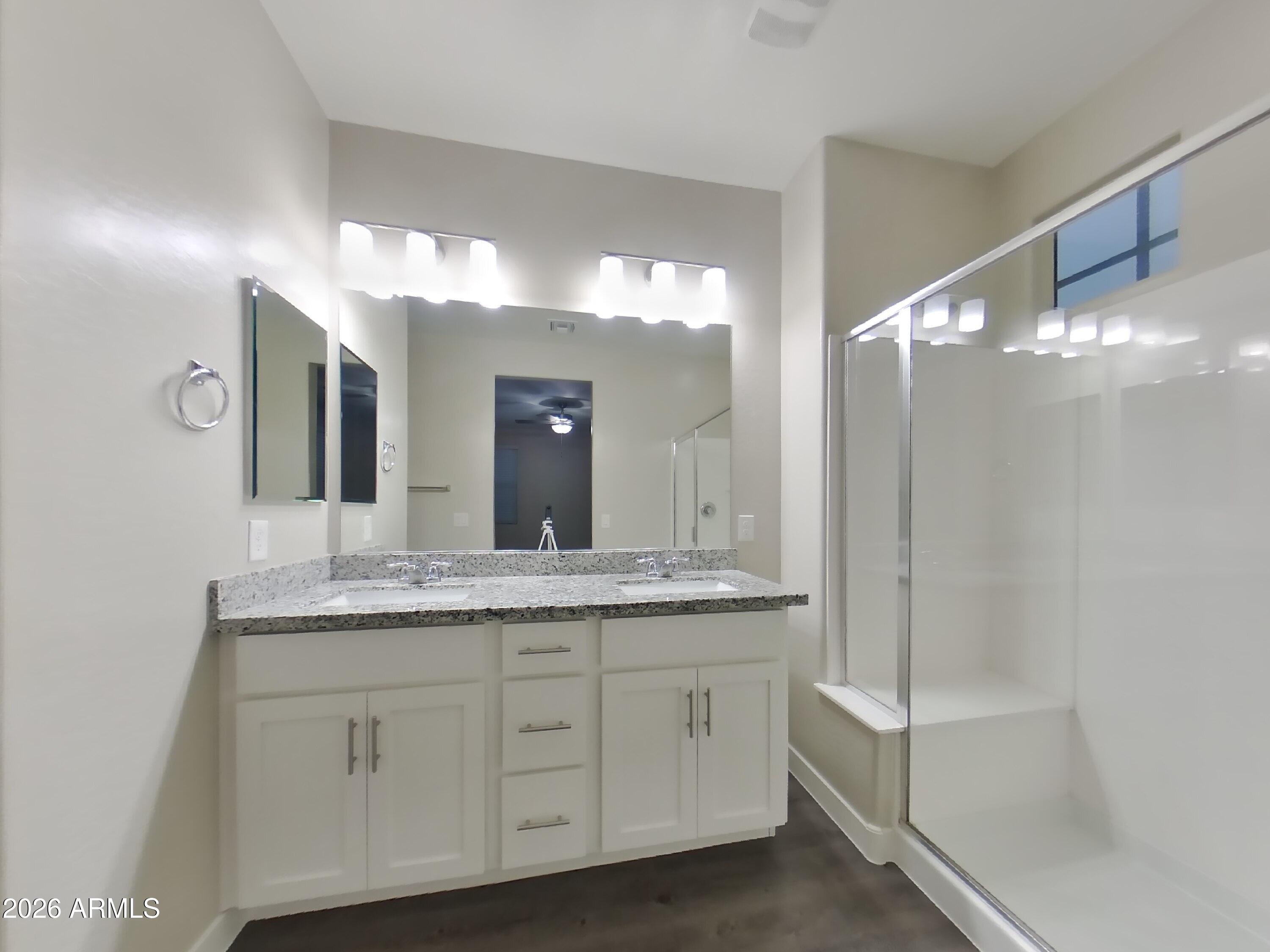 2929 North 28th Street, Unit 9 Phoenix, AZ 85016 - Photo 8 of 16 a bathroom with a double vanity sink and a mirror
