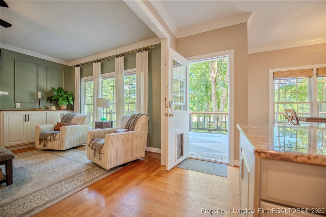 218 Waterville Street Raleigh, NC 27603 - Photo 16 of 49 a living room with furniture and large windows