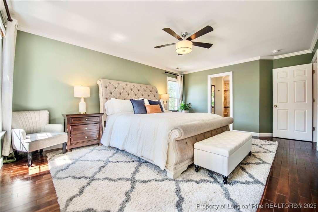 218 Waterville Street Raleigh, NC 27603 - Photo 22 of 49 a spacious bedroom with a bed and a chandelier