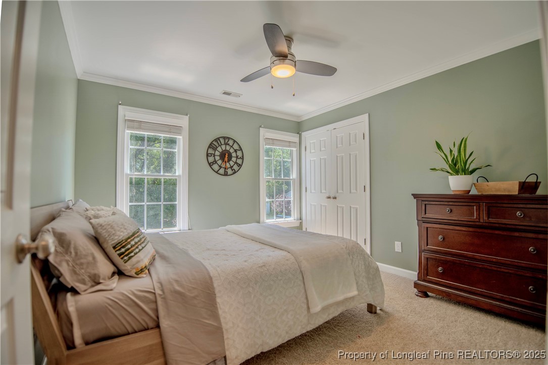218 Waterville Street Raleigh, NC 27603 - Photo 31 of 49 a bedroom with a bed dresser and a window