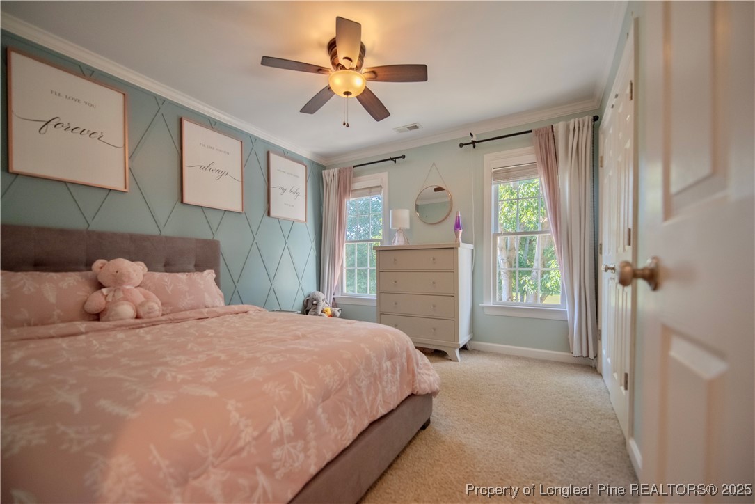 218 Waterville Street Raleigh, NC 27603 - Photo 33 of 49 a bedroom with a bed next to a window