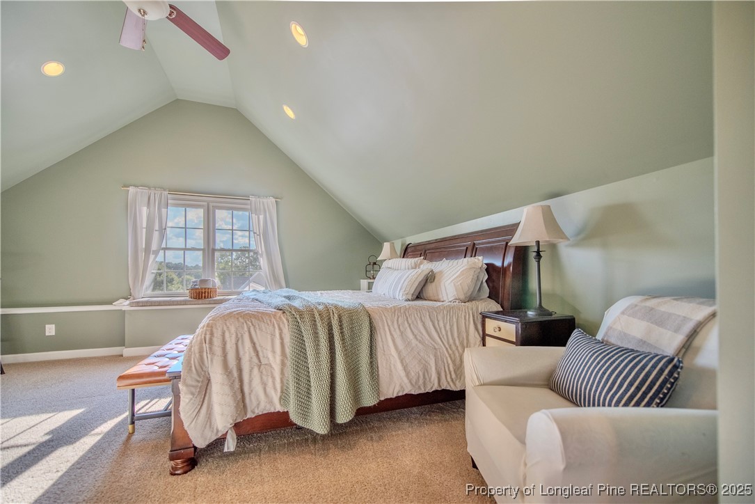 218 Waterville Street Raleigh, NC 27603 - Photo 34 of 49 a bedroom with bed and a couch