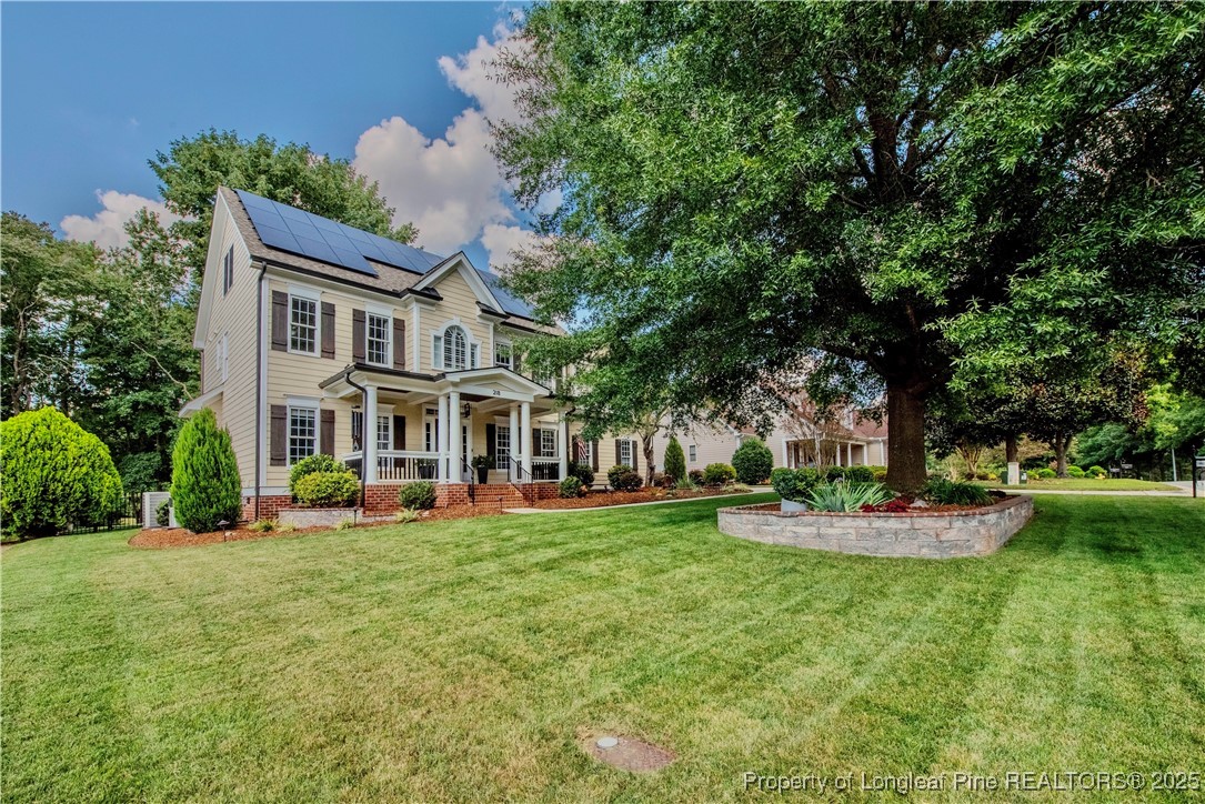 218 Waterville Street Raleigh, NC 27603 - Photo 4 of 49 a front view of a house with a yard