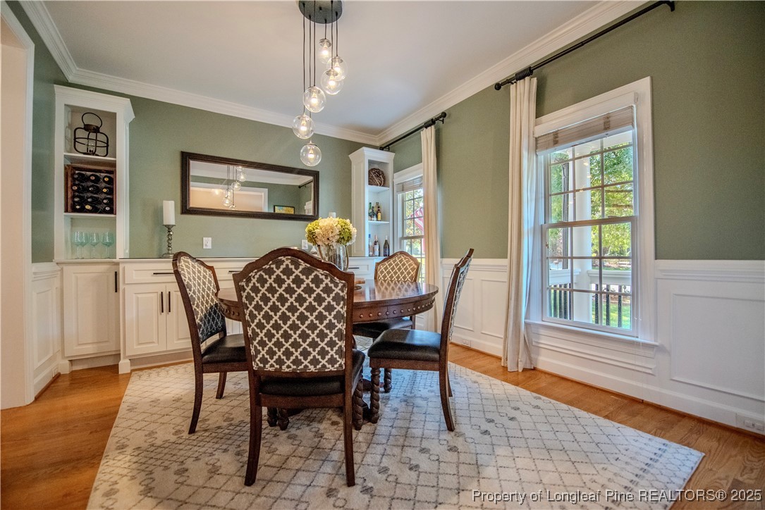 218 Waterville Street Raleigh, NC 27603 - Photo 8 of 49 a view of a dining room with furniture window and wooden floor