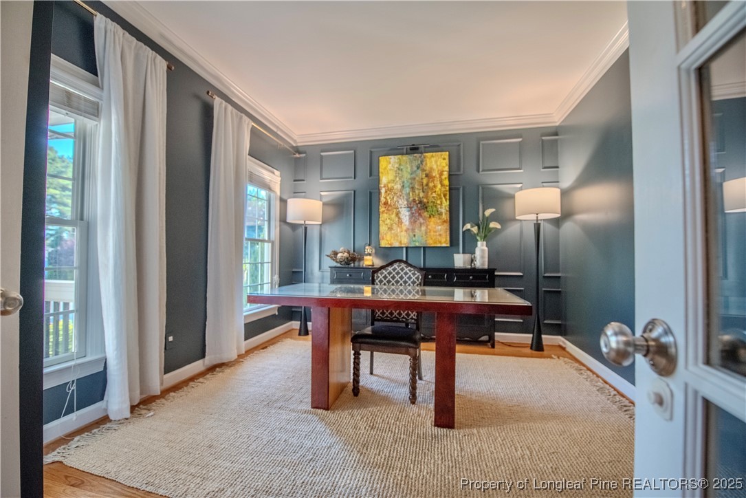 218 Waterville Street Raleigh, NC 27603 - Photo 10 of 49 a view of a workspace with furniture and a window