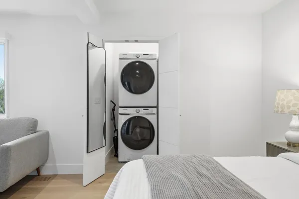 a bedroom with a bed and a couch