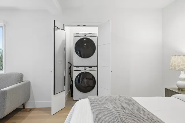 a bedroom with a bed and a couch