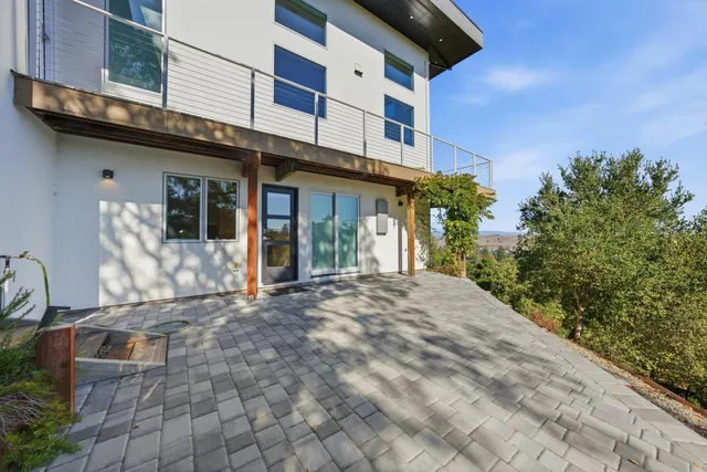 a view of a building with potted plants