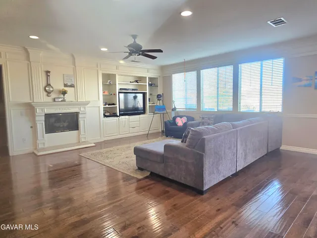 a room with a exposed radiator down to a window